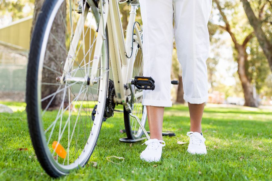 a feet of pair next to a cycle