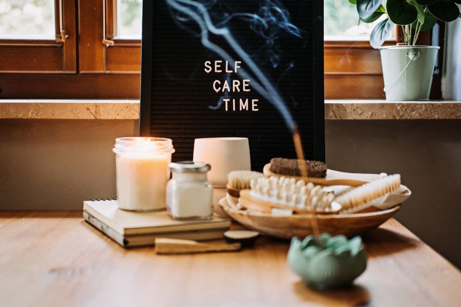 self care time board with scented candles and incense