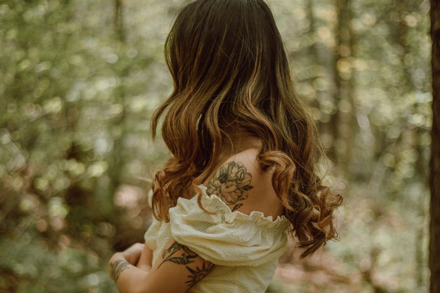 flower tattoo on woman's arm