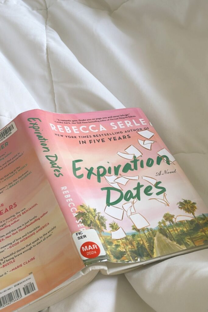 Expiration Dates book by Rebecca Serle lying on bed